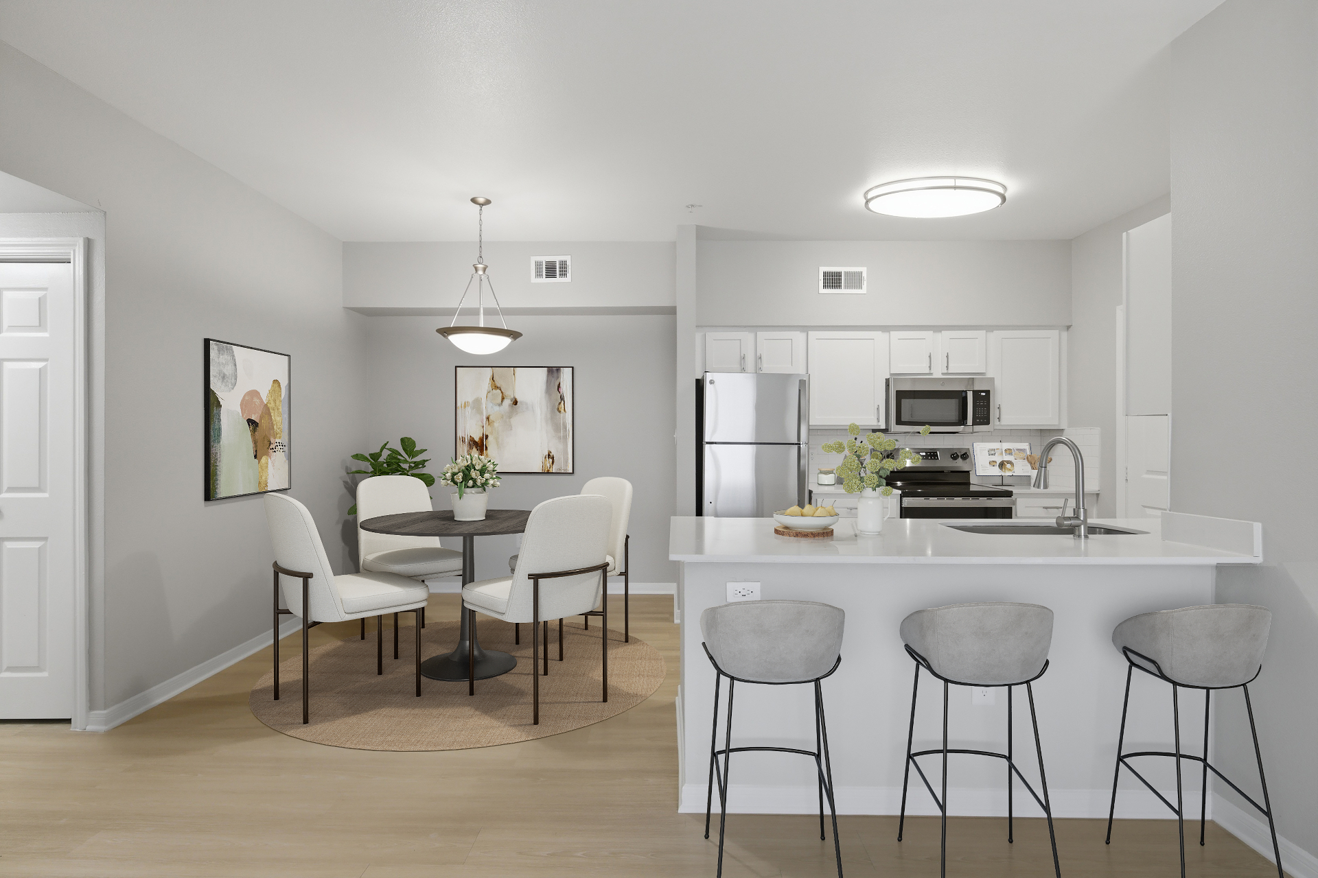 Open kitchen and dining area with breakfast bar seating