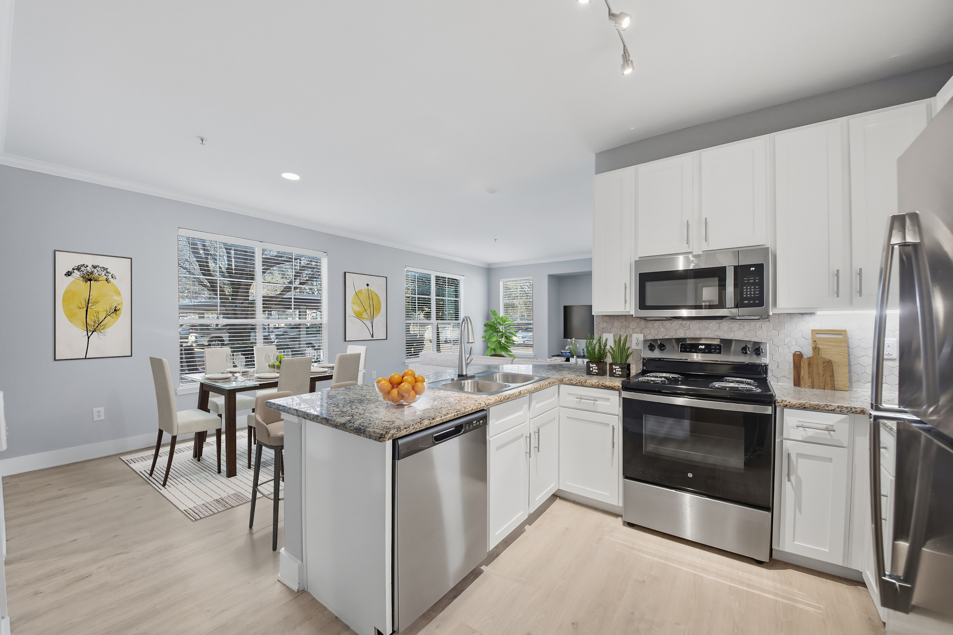 Spacious kitchen with granite counters and natural light